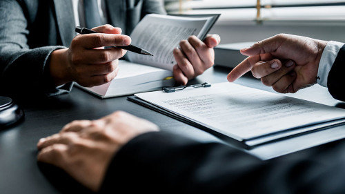 Close up of businessmen or lawyers discussing contract or busine