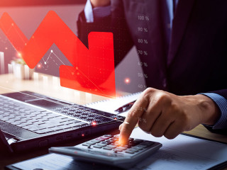 Business recession concept, crisis. business people analyzing sales data and the falling economic graph, Decreased funds and money. Fall of economy, capital reduction. Inflation. Falling income in GDP