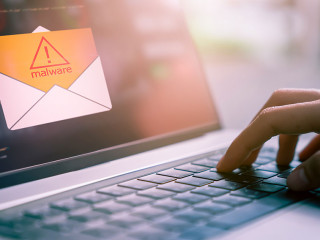 Concept of cyber crime, hand using laptop and show malware screen that comes with email, hack password and personal data.