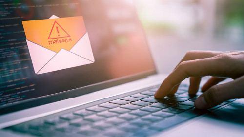 Concept of cyber crime, hand using laptop and show malware screen that comes with email, hack password and personal data.