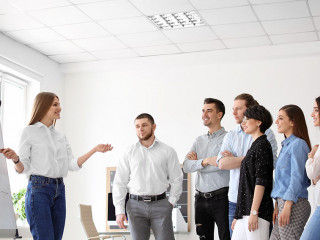 Female business trainer giving lecture in office