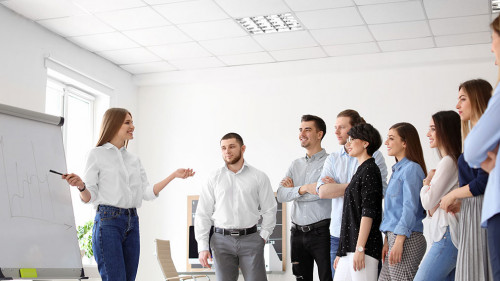 Female business trainer giving lecture in office