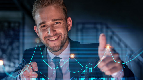 Portrait of handsome businessman in formal suit thinking how to optimize trading strategy at corporate finance fund. Forex chart hologram over modern office background