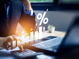 Interest rate and dividend concept, Businessman is calculating income and return on investment in percentage. income, return, retirement, compensation fund, investment, dividend tax, stock market