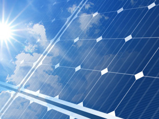 solar panels on blue sky and sun