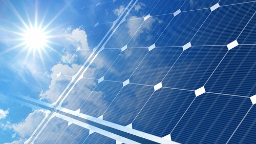 solar panels on blue sky and sun