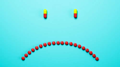 Abstract frowning pills background