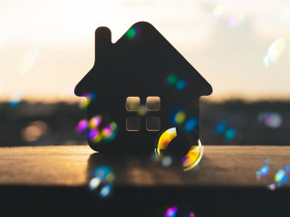 House model on black table with many bubble and black background