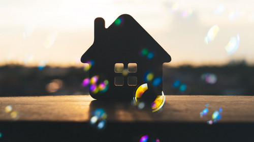 House model on black table with many bubble and black background
