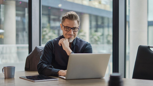 Businessman working with laptop in office