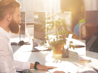 Businessman in office connected on internet network with computer