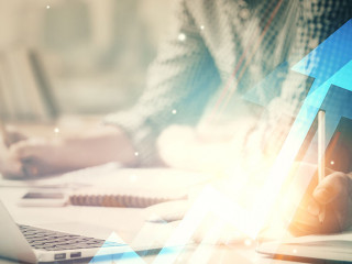 Growing arrows with businessman working on computer on background. Success concept. Double exposure.