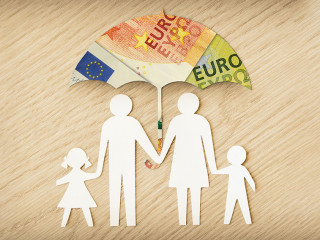 Paper family silhouette with umbrella made of euro banknotes on