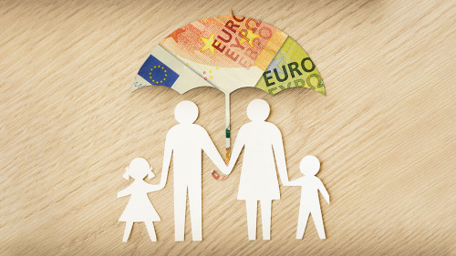 Paper family silhouette with umbrella made of euro banknotes on