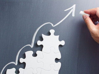 Steps shaped jigsaw puzzle. Drawing arrow on blackboard.