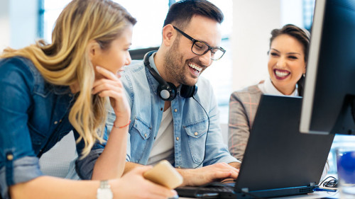 Group of business people and software developers working as a te