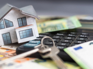 Model house, calculator, euro notes