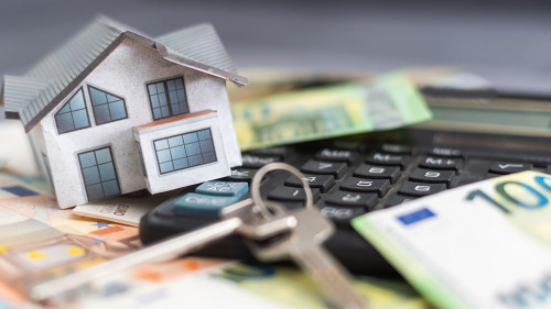 Model house, calculator, euro notes