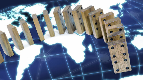 domino effect risk around world map concept background