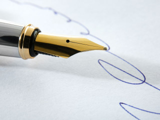 Notary public signature and fountain pen, close up view