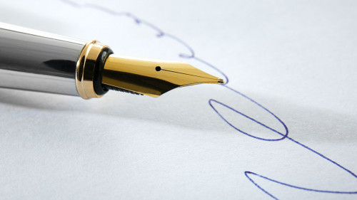 Notary public signature and fountain pen, close up view