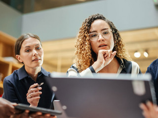 Female Manager Leading a Meeting About Sustainability and Ethnic