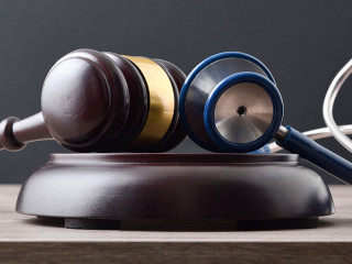 Fair social justice concept with gavel and stethoscope front vie