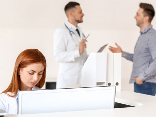Female medical assistant working in clinic