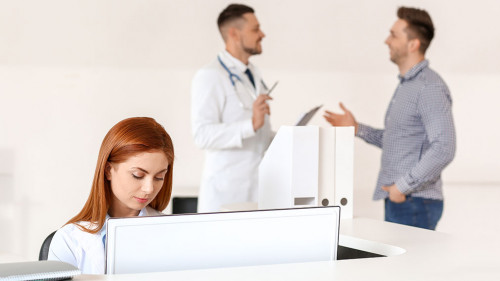 Female medical assistant working in clinic