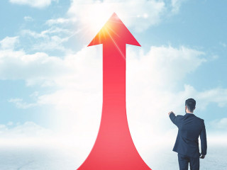 businessman standing on a red arrow