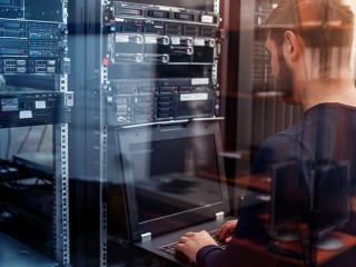 network engineer working in server room