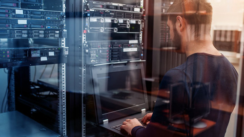 network engineer working in server room