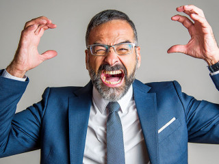 Enraged angry business man yelling and screaming with fury and f