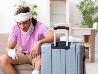 Young injured man preparing for the trip