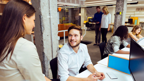 People working at busy modern office
