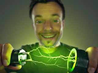 Man connecting green energy power plug