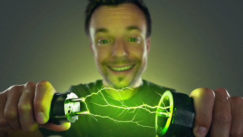 Man connecting green energy power plug