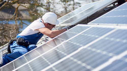 Installing solar photovoltaic panel system on roof of house