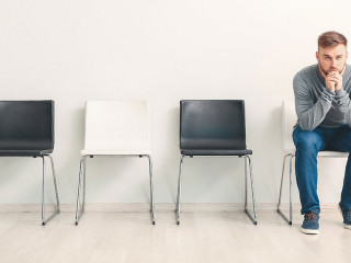 Young man waiting for job interview indoors