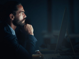 Digital programmer, cyber security and programmer with computer thinking and planning of web design at night. Engineer, developer and man working on ux seo software, database coding and programming