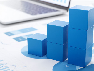 Business growth and analysis. Many graphs on reports and lapto