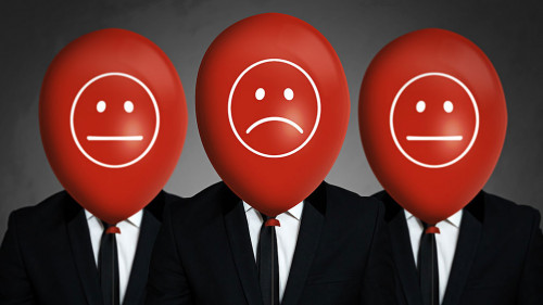 Businessmen with balloons