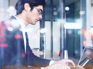 Businessman works at home with a laptop. concept of internet sharing. Double exposure