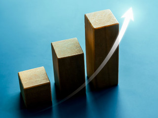 Shining rise up arrow on wooden cube blocks, bar graph chart ste