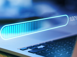 Digital world concept with hologram digitalization word and loading bar element icon on laptop keyboard background