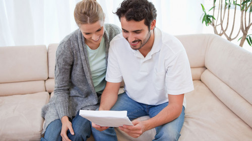 Couple reading a letter