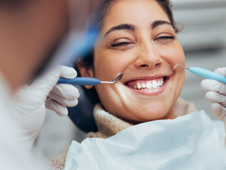 Woman smiling during dental checkup