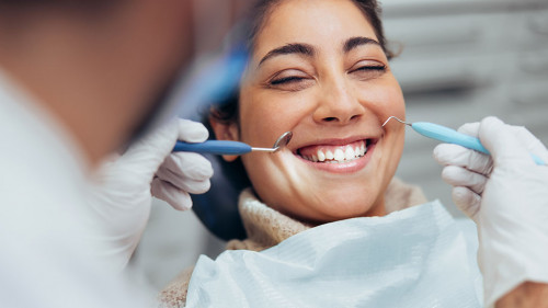 Woman smiling during dental checkup