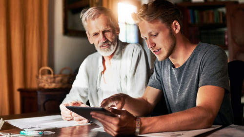 Heres a better explanation. two men working on a project together at home.