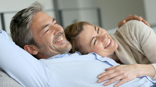 Mature couple relaxing in sofa, peaceful scene